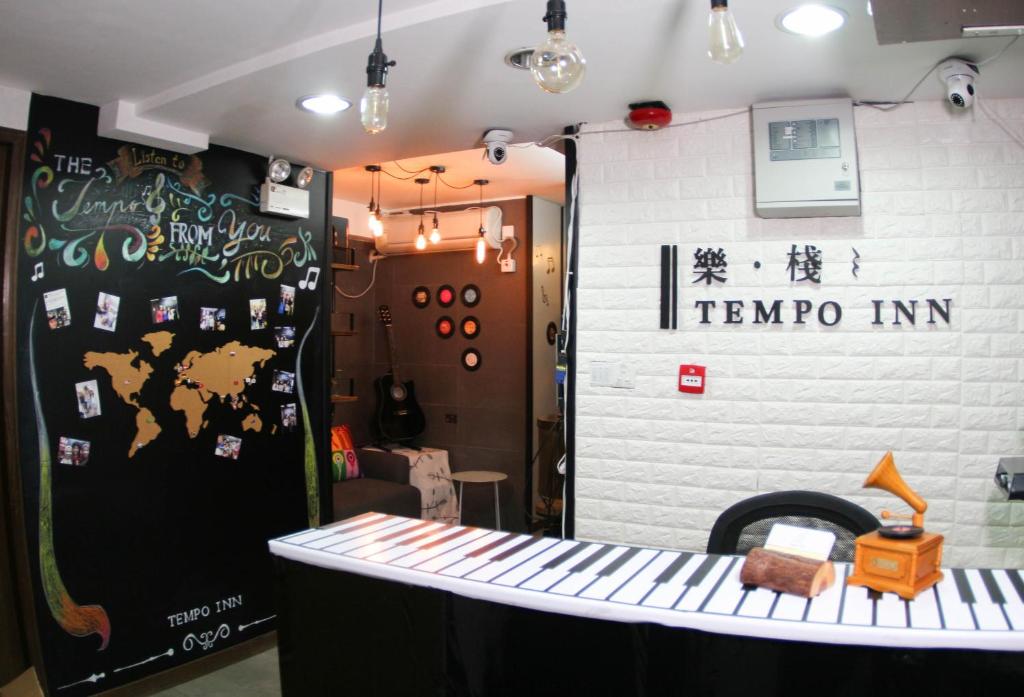 a stage with a sign that reads temro inn at Tempo Inn West Kowloon HSR Station in Hong Kong