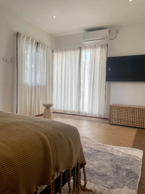 TV a/nebo společenská místnost v ubytování Attitude Resort Langkawi