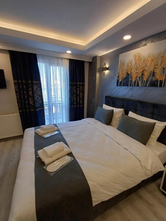 Postel nebo postele na pokoji v ubytování White Palace Haliç
