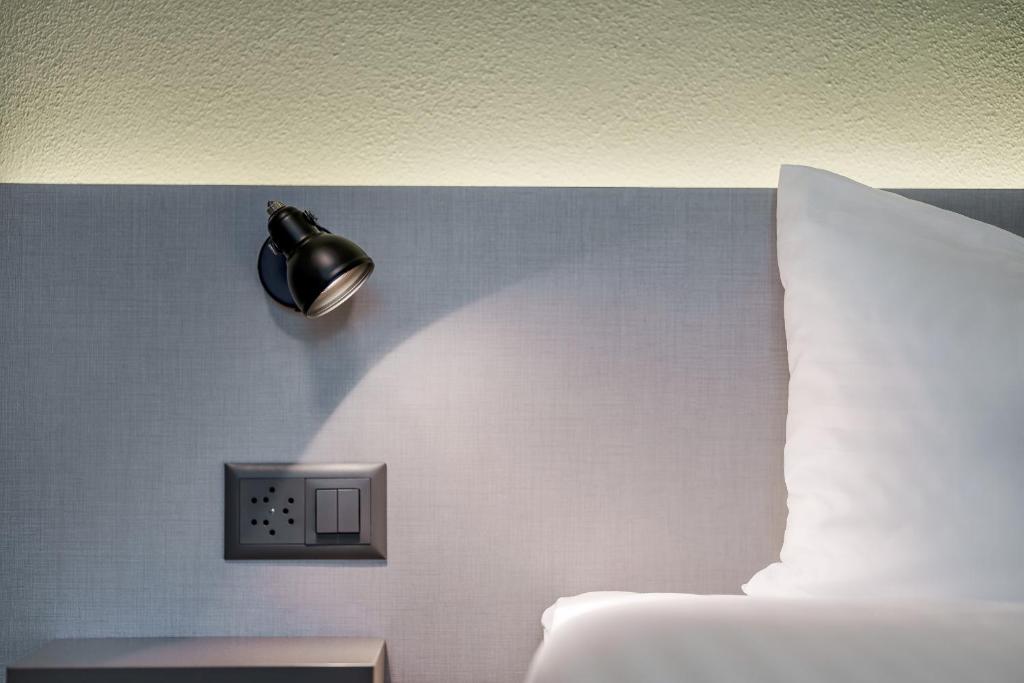 Postel nebo postele na pokoji v ubytování flexymotel Wil
