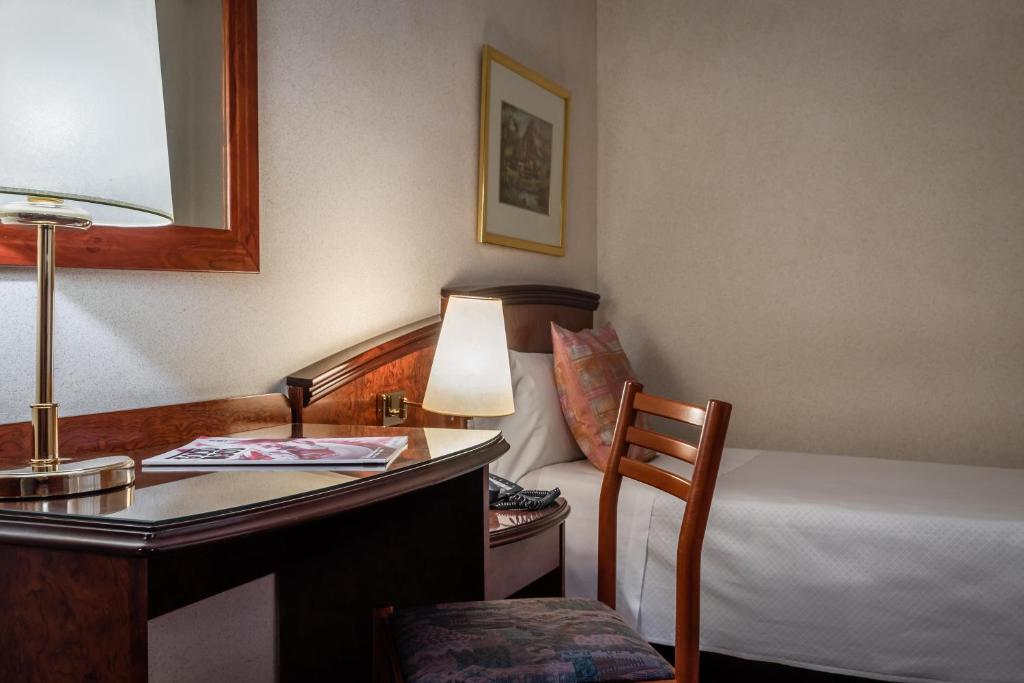 Cama o camas de una habitación en ALEGRIA President