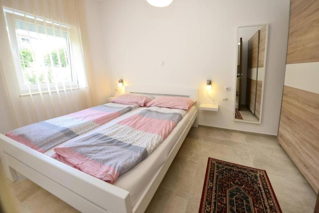 Postel nebo postele na pokoji v ubytování Vila Matkovic