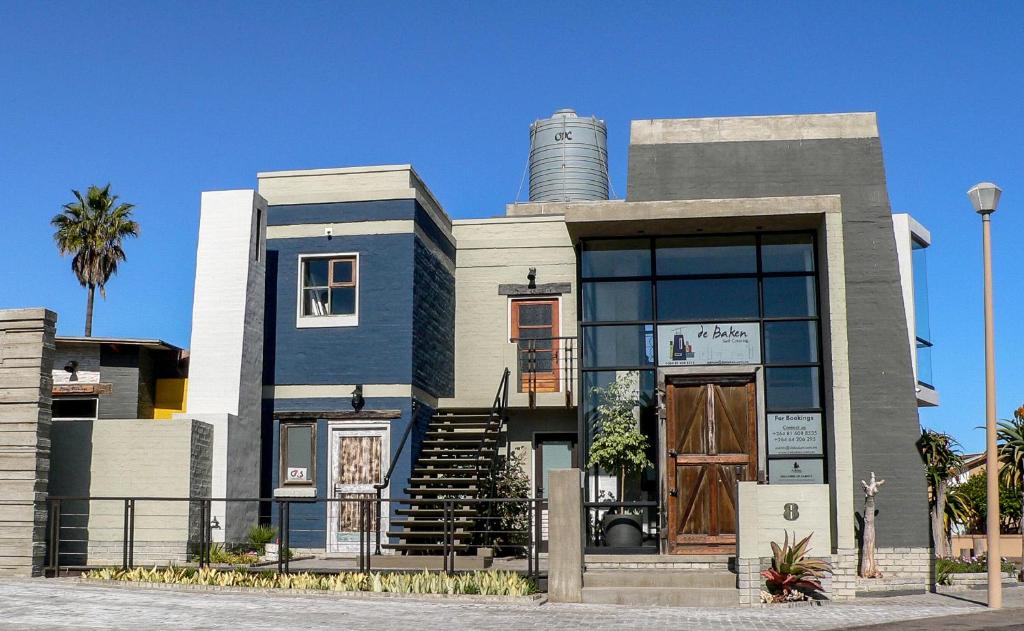 a building with a silo on top of it at de Baken Self-Catering in Walvis Bay