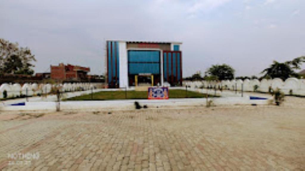 a large building in the middle of a park at Buddha Resort hotel & restaurant,Aurangabad in Aurangābād