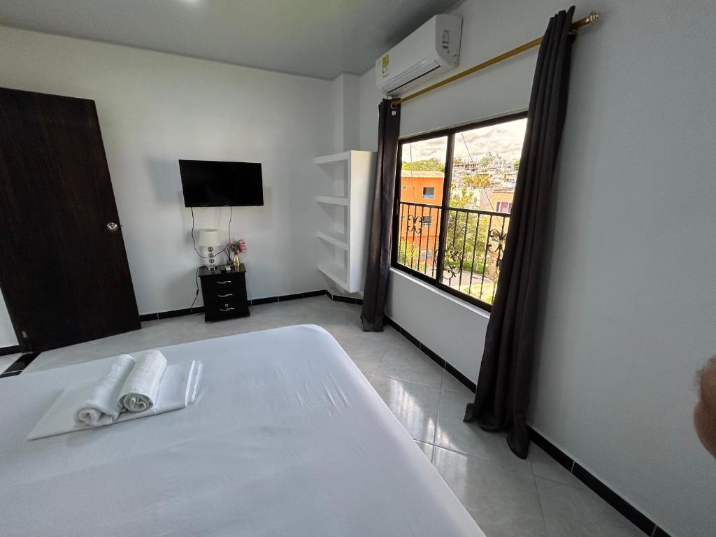Postel nebo postele na pokoji v ubytování Hotel SG