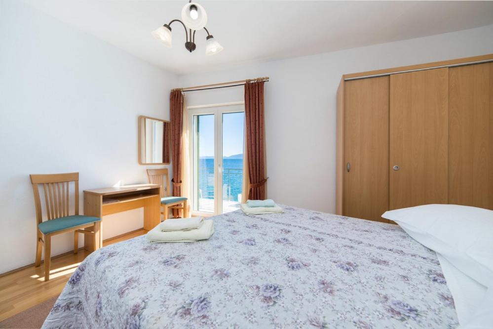 Postel nebo postele na pokoji v ubytování Apartments Dominko