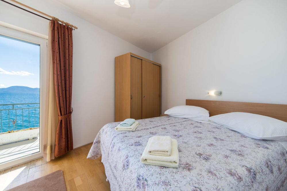 Postel nebo postele na pokoji v ubytování Apartments Dominko