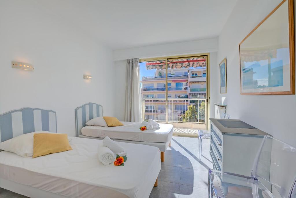 Posteľ alebo postele v izbe v ubytovaní Appartement Le Fabiola - Happy Rentals