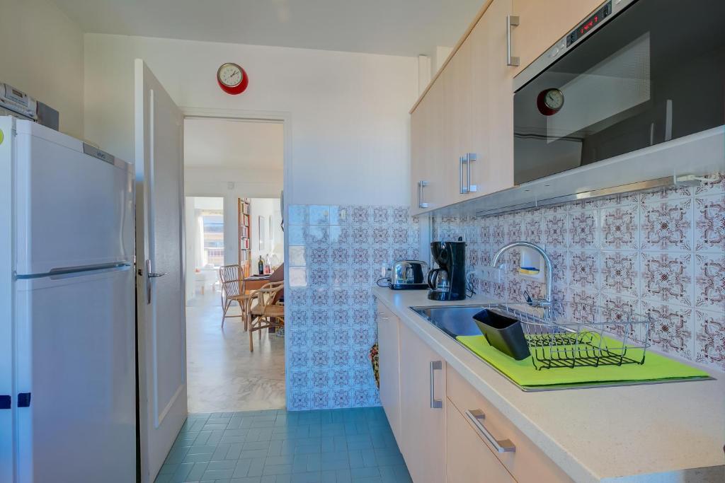 Kuchyňa alebo kuchynka v ubytovaní Appartement Le Fabiola - Happy Rentals