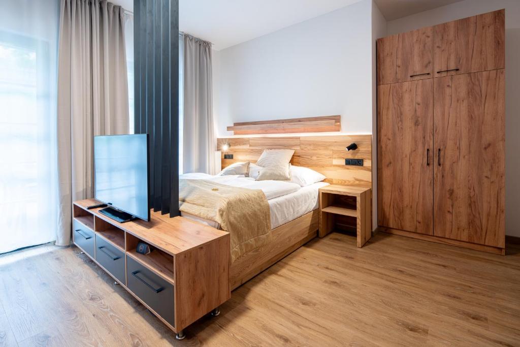 Postel nebo postele na pokoji v ubytování Resort Aurum Residence A