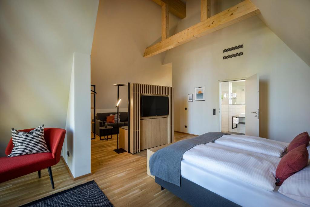 Postel nebo postele na pokoji v ubytování JUFA Hotel Bregenz
