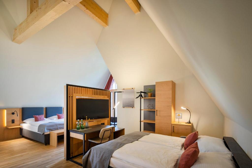 Postel nebo postele na pokoji v ubytování JUFA Hotel Bregenz