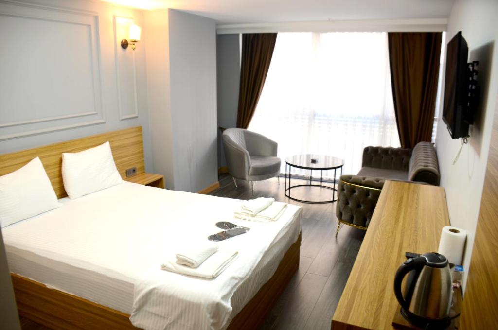 Postel nebo postele na pokoji v ubytování Waves hotel