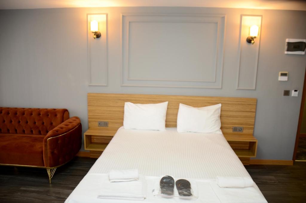 Postel nebo postele na pokoji v ubytování Waves hotel