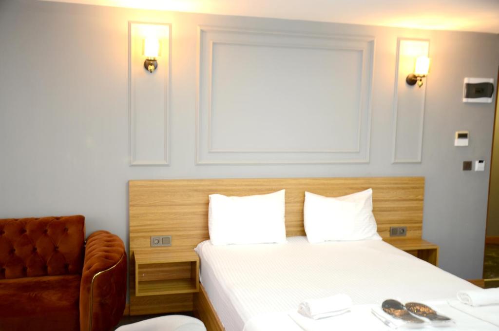 Postel nebo postele na pokoji v ubytování Waves hotel