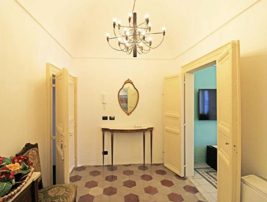 Televízia a/alebo spoločenská miestnosť v ubytovaní Casa Tiffany