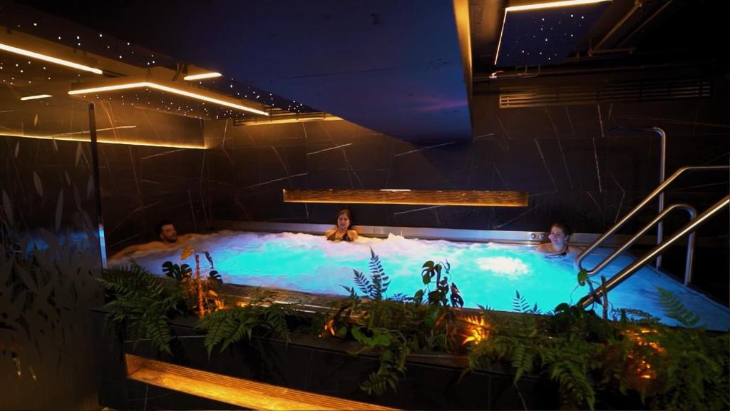 a group of people in a hot tub at The Address Connolly in Dublin