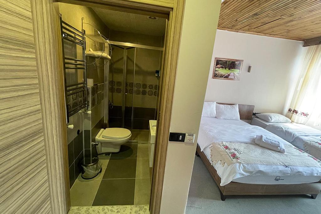 Postel nebo postele na pokoji v ubytování Osmanlı Paşa Otel- Konaklama
