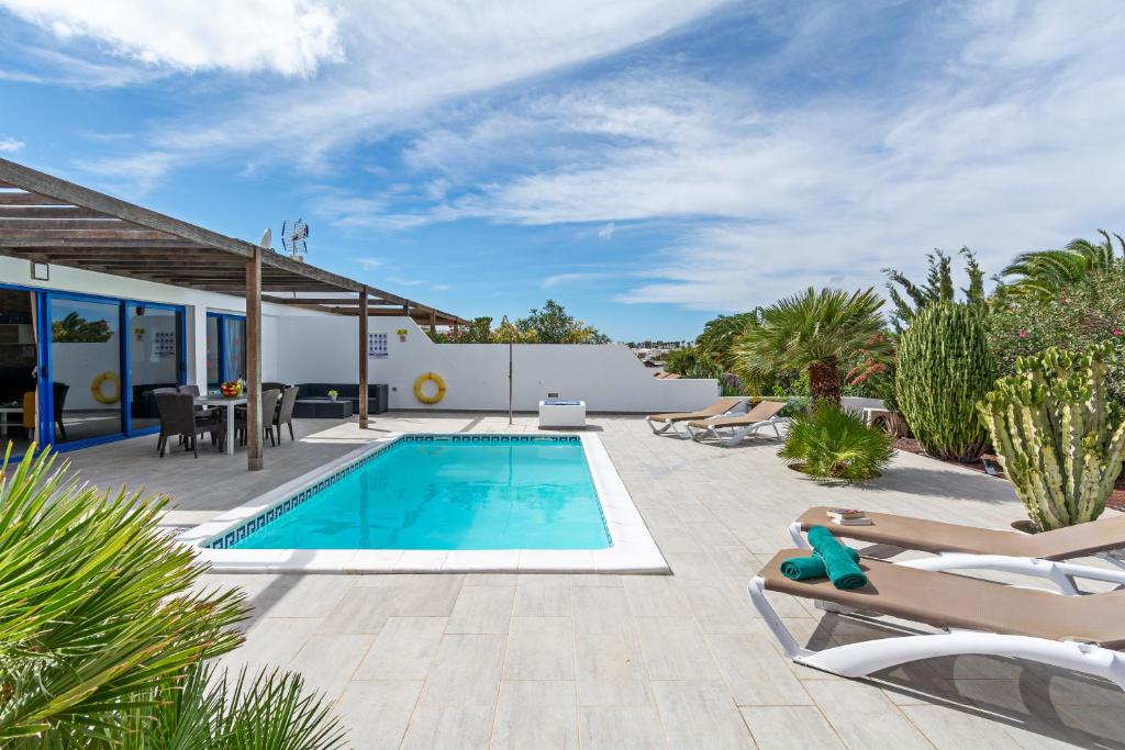 a villa with a swimming pool and a patio at Villa Valentina Private Pool Playa Blanca By PVL in Playa Blanca