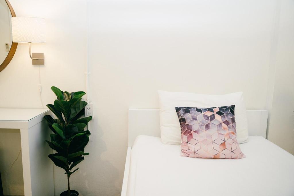 Postel nebo postele na pokoji v ubytování Qilombo Hostel Silom - HQ