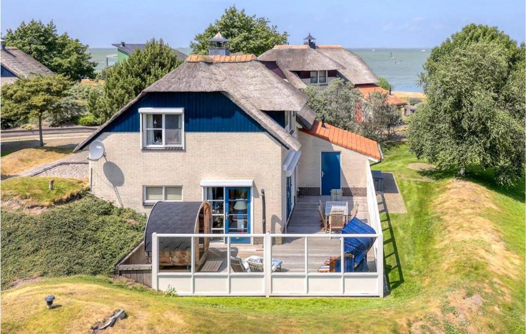 een luchtzicht op een huis met een balkon bij Ocean Front Home In Makkum With House A Panoramic View in Makkum