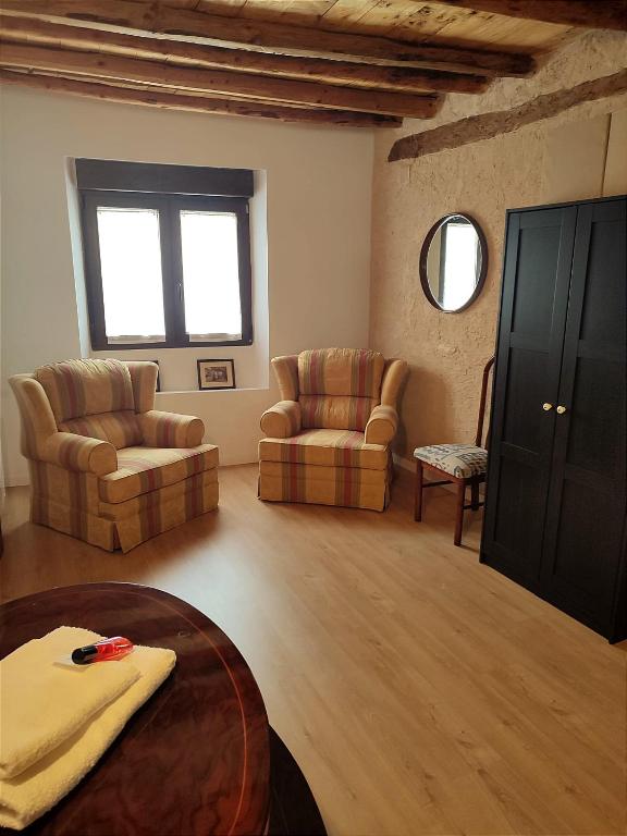 A seating area at Casa Rural Casona Camino Pedraza - 4 Estrellas