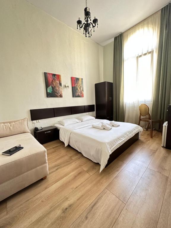 Ένα ή περισσότερα κρεβάτια σε δωμάτιο στο Hotel Ilisia 