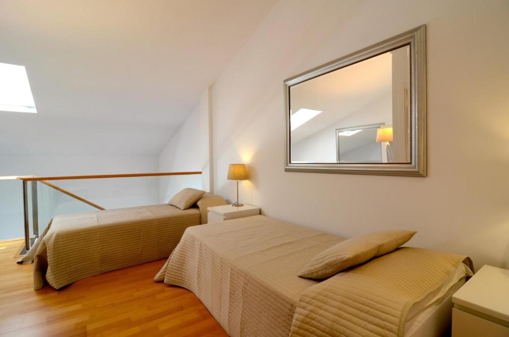 Postel nebo postele na pokoji v ubytování ESGLESIA 7 - Apartamento duplex