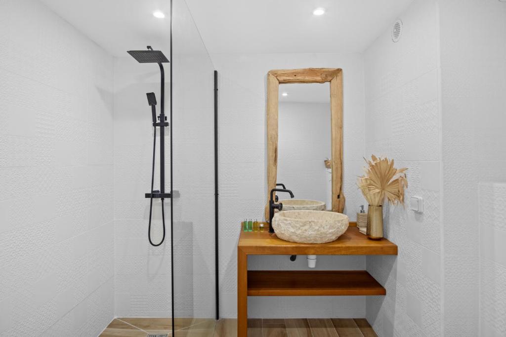 a bathroom with a sink and a shower at Studio Sunshine in Le Diamant