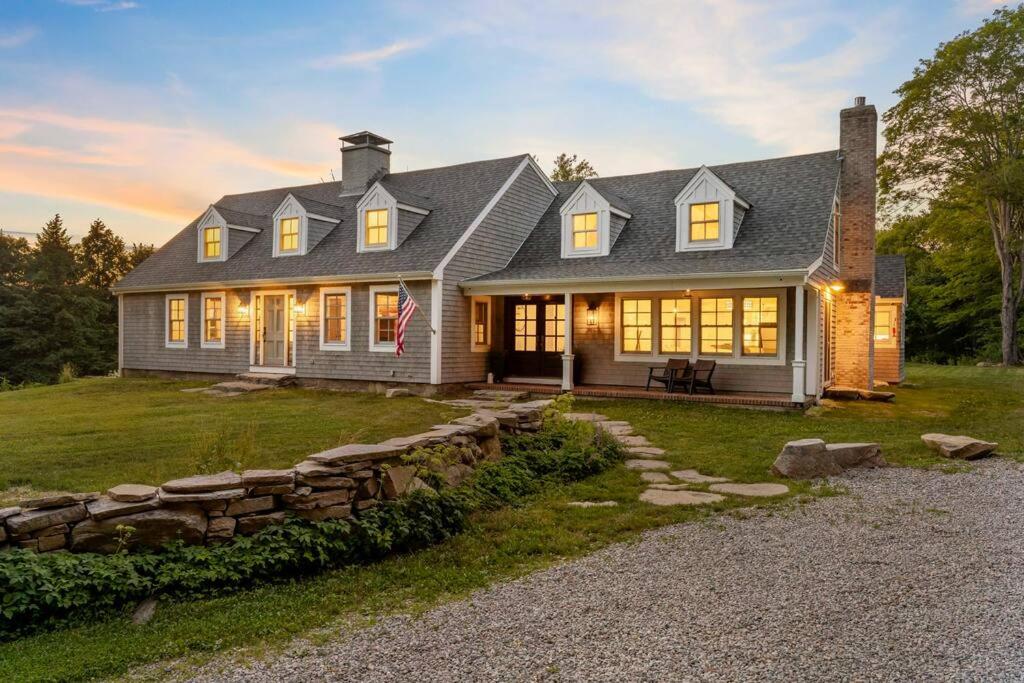 a large house with a stone wall at The Wolfstead - near Mystic, Casinos & Beaches in Stonington