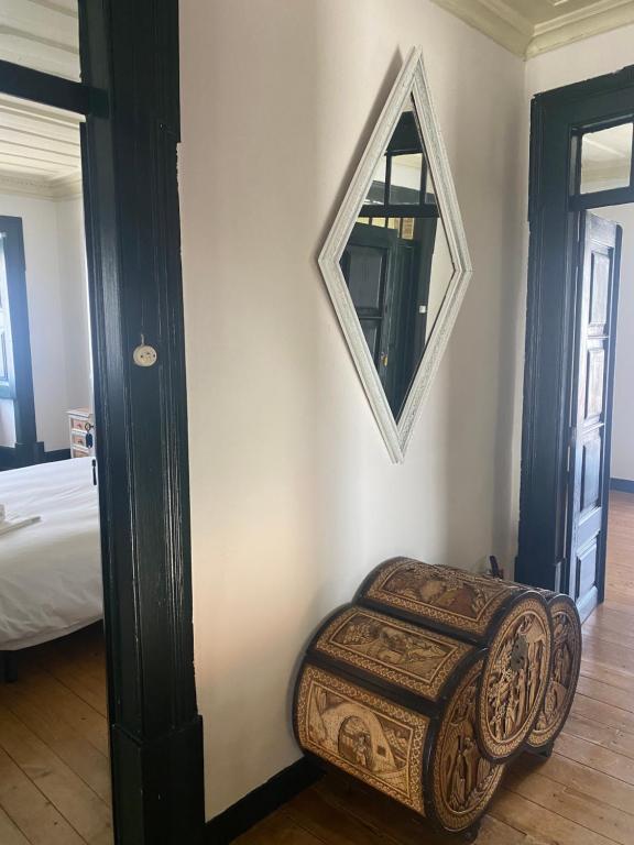 Uma cama ou camas num quarto em Casa de Lagarinhos JACUZZI SPA JOGOS GYM - SERRA DA ESTRELA - SEIA - GOUVEIA