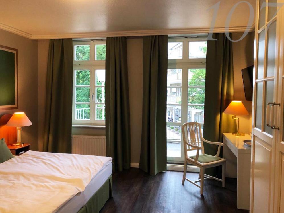 Postel nebo postele na pokoji v ubytování Rein Klassik Hotel