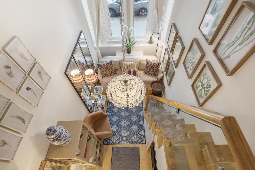 an overhead view of a staircase with a table at Stylish Studio in Kensington in London