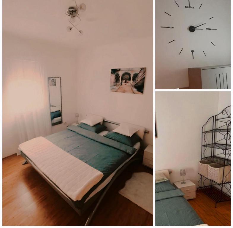 a bedroom with a bed and a clock on the wall at Home Away From Home - New Cosy Apartment Kruge in Zagreb