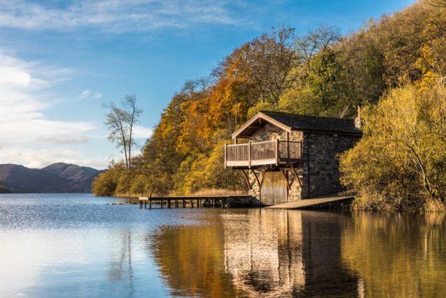 a bridge over a large body of water at Duke of Portland Boathouse on the shore of Lake Ullswater ideal for a romantic break in Pooley Bridge