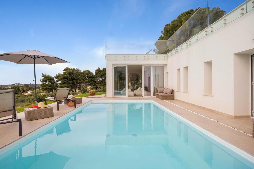 Πισίνα στο ή κοντά στο Curina Luxury Villa