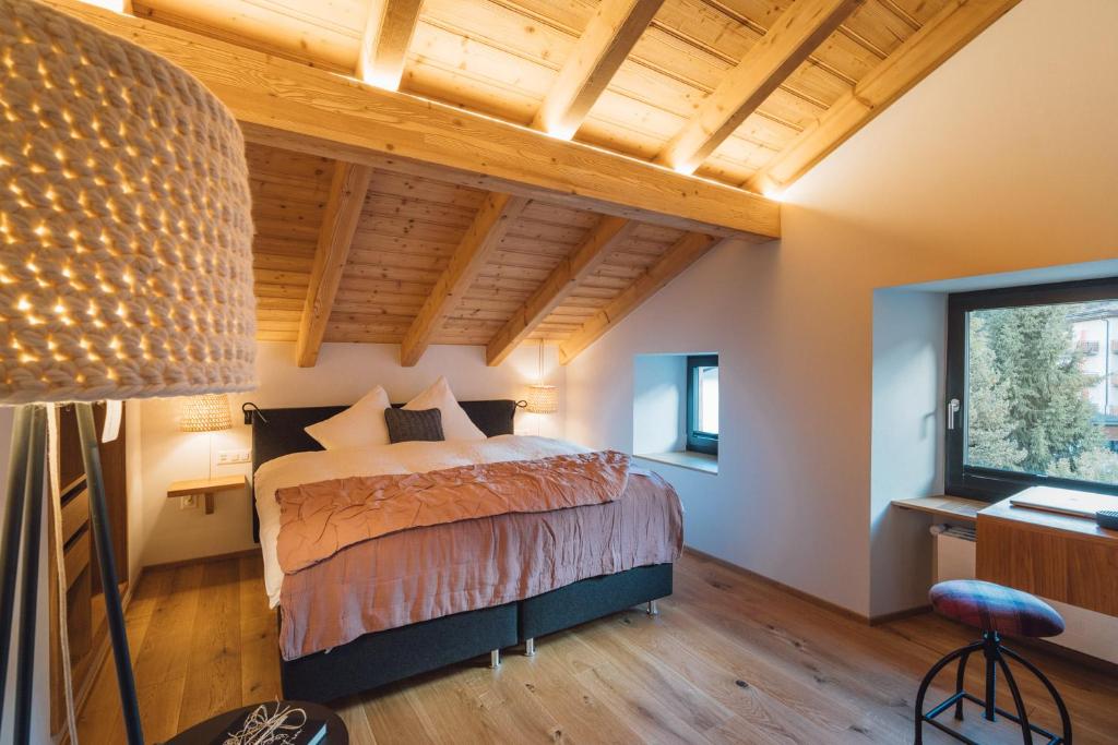 Postel nebo postele na pokoji v ubytování Hotel Walliserkanne