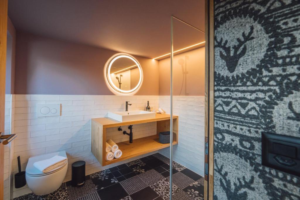 Koupelna v ubytování Hotel Walliserkanne