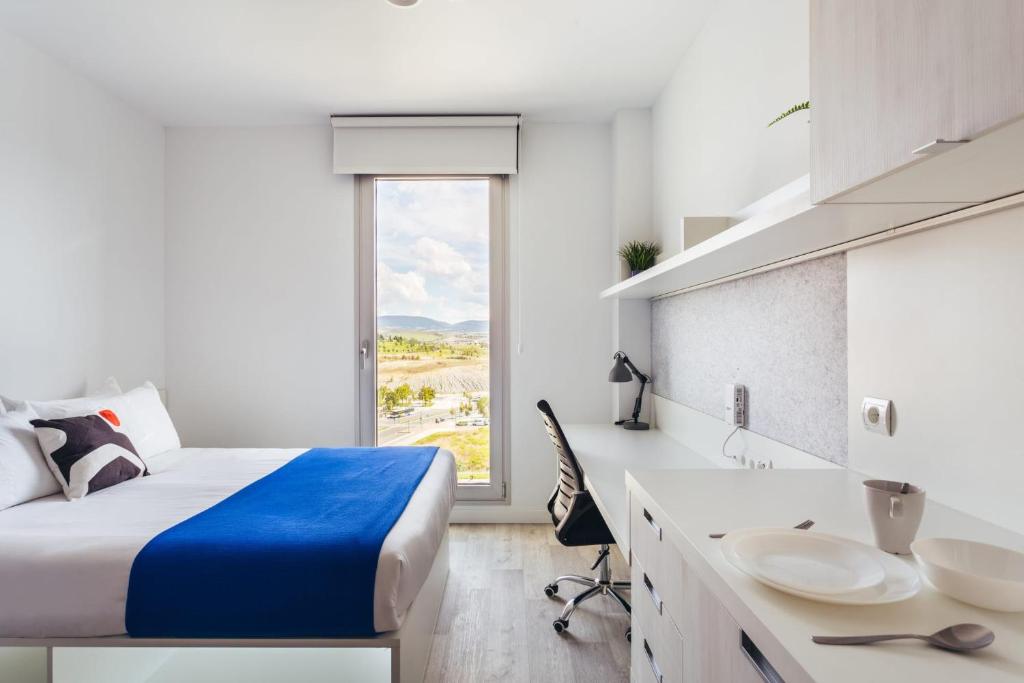 Postel nebo postele na pokoji v ubytování Soto House Pamplona