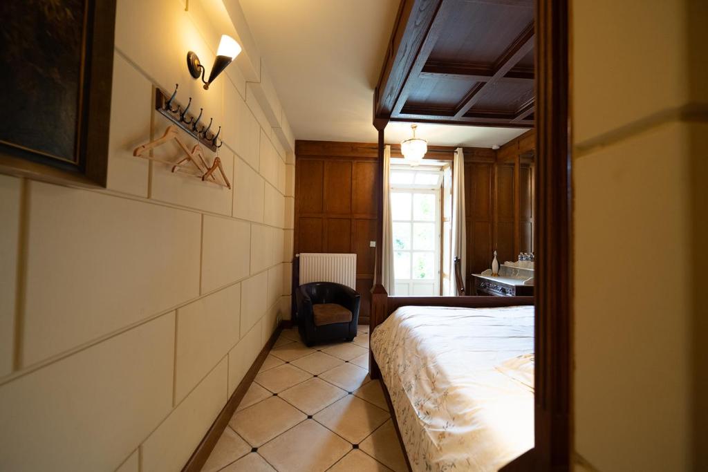 Postel nebo postele na pokoji v ubytování Chateau de Bézyl