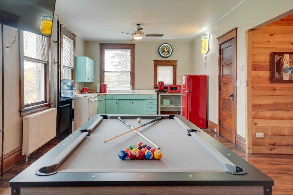 a pool table in the middle of a kitchen at Spacious Home in Ramsay 9 Smart TVs and Pool Table! in Ramsay
