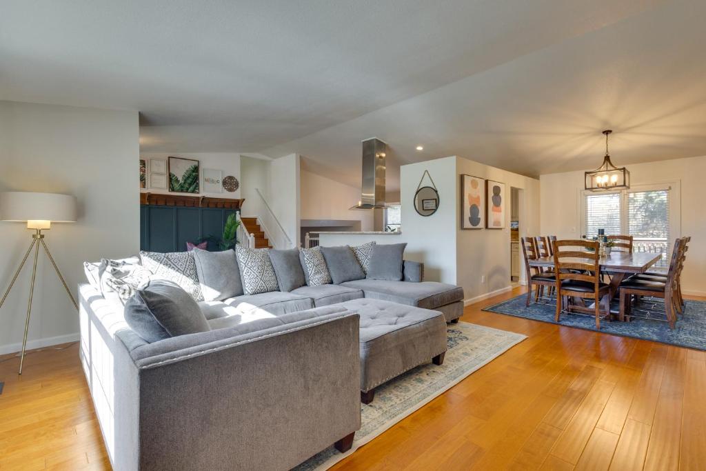 a living room with a couch and a table at Spacious Colorado Springs Home with Fire Pit! in Colorado Springs