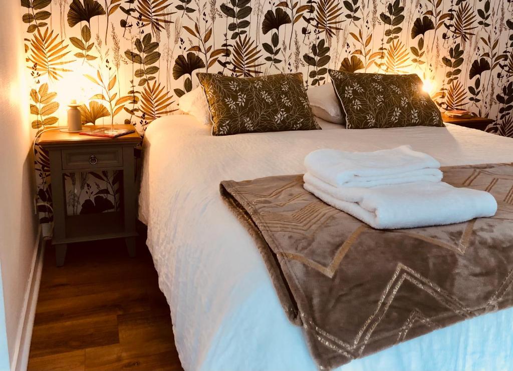 Postel nebo postele na pokoji v ubytování L’AMANTINE Chambres d’hôtes et gîte