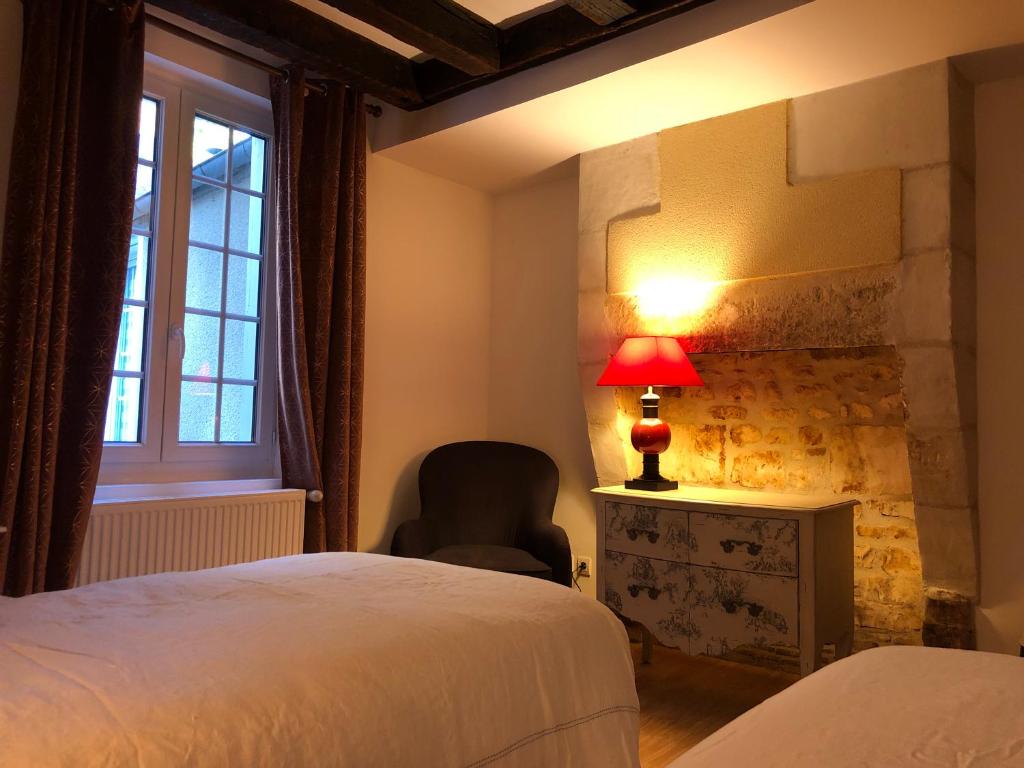 Postel nebo postele na pokoji v ubytování L’AMANTINE Chambres d’hôtes et gîte