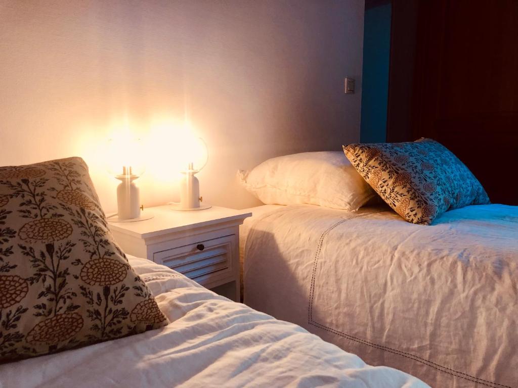Postel nebo postele na pokoji v ubytování L’AMANTINE Chambres d’hôtes et gîte