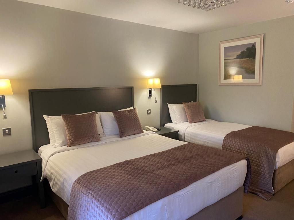 Postel nebo postele na pokoji v ubytování Arklow Bay Hotel