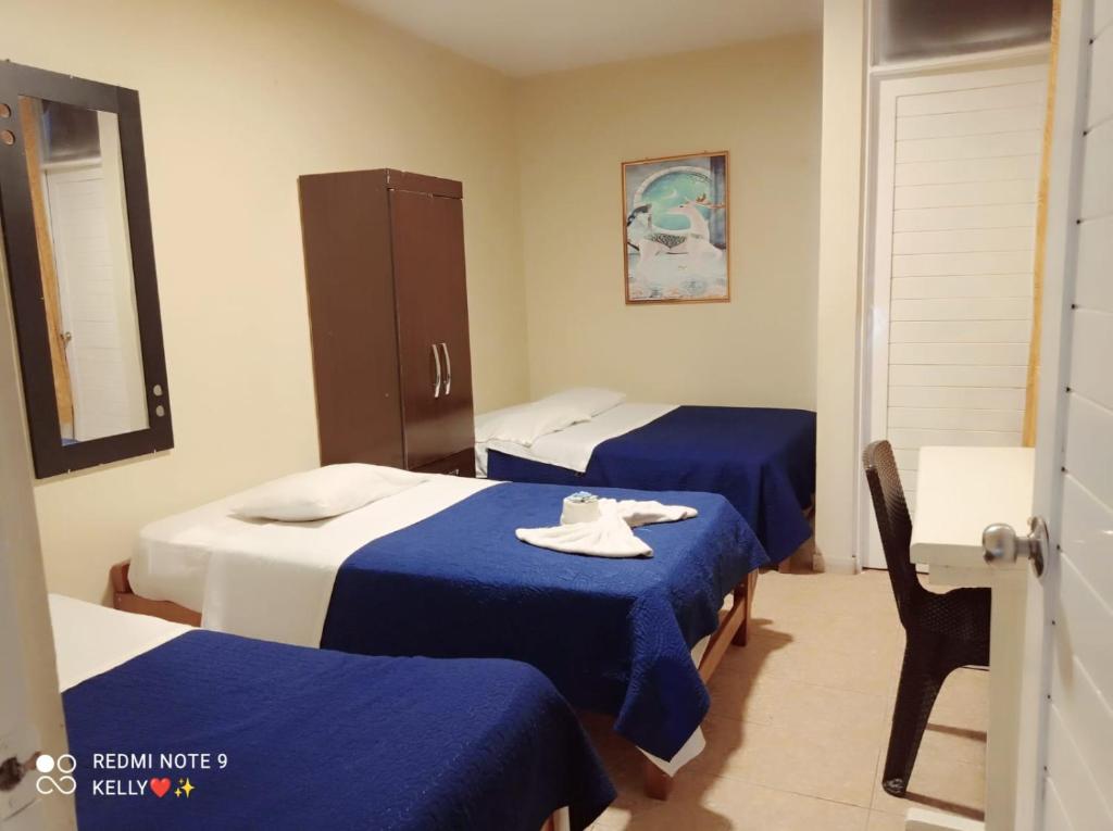 Postel nebo postele na pokoji v ubytování Hostal Real Piura - Oficial