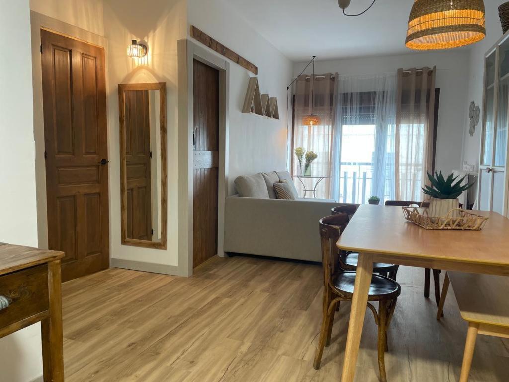 a living room with a dining table and a living room at Casa Mariete in Villanúa
