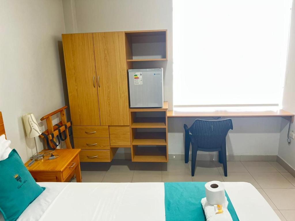 Postel nebo postele na pokoji v ubytování Hotel Reycer