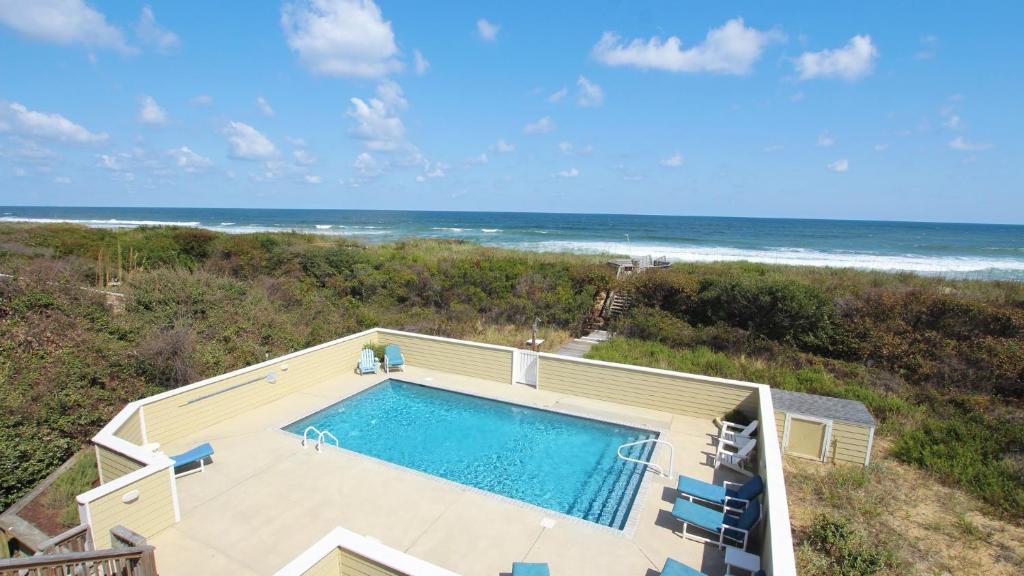 an overhead view of a swimming pool and the ocean at PI76, Life of Reilly- Oceanfront, Ocean Views, Private Pool, Private Beach Access, Foosball in Corolla